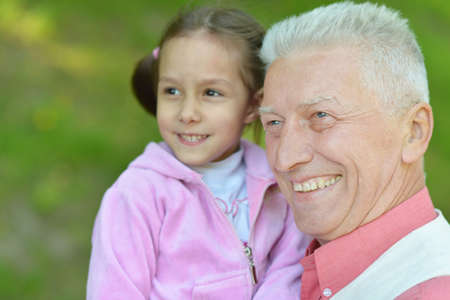 Girl with his grandparent play at natureの写真素材