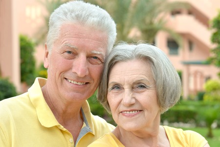 happy loving elder couple at tropic resortの写真素材