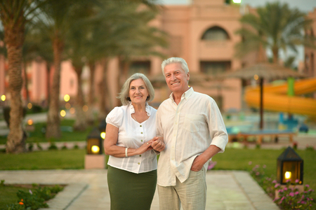 Senior couple have fun at tropic hotel gardenの写真素材