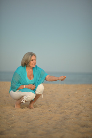 Nice senior woman went to a resort vacationの写真素材