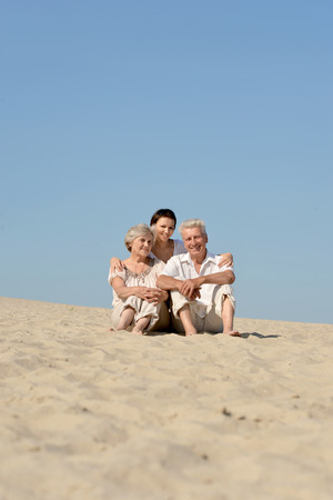 people are resting in the sand on a summer dayの写真素材