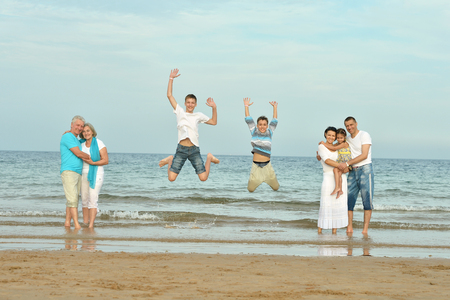 Portrait of a happy family at beach in summerの写真素材