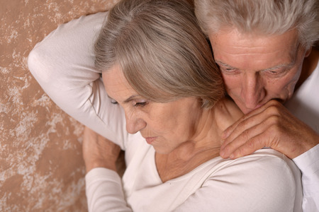 Sad Senior couple at homeの写真素材