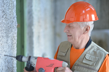 Man does the construction work with the punchの写真素材