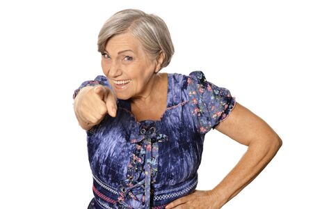 Portrait of senior woman pointing at youの写真素材