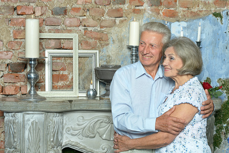 Portrait of beautiful elderly couple in vintage interiorの写真素材