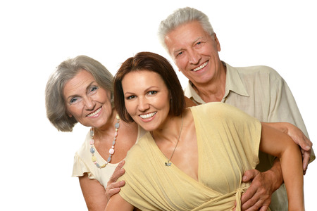 cheerful elderly parents with adult daughter on a white background