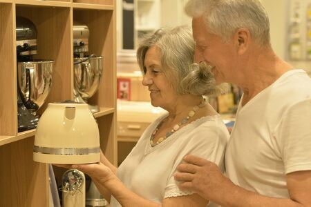 Beautiful senior couple in a shopping centerの写真素材
