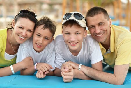 Happy family having lunch on a beach
