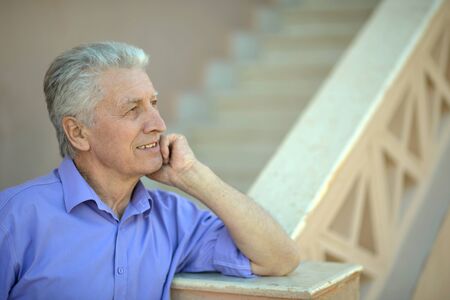 portrait of a cute thoughtful senior manの写真素材