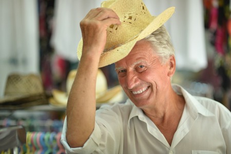 Portrait of senior man at shop hatsの写真素材