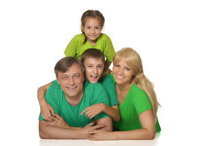 Nice family in bright T-shirts on a white background