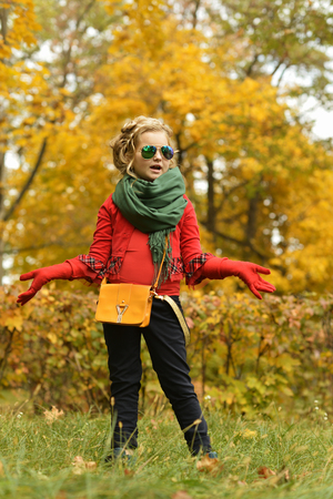 Beautiful cute girl on a day walk in the parkの写真素材