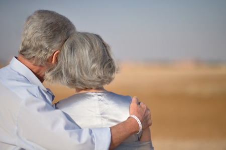 Happy Mature couple in love enjoy fresh air and stunning view on vacationの写真素材