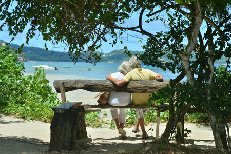 Happy elderly couple rest at tropical resortの写真素材