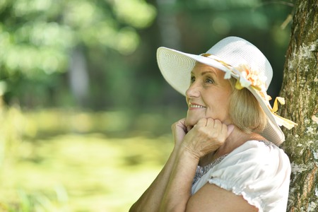 Portrait of a senior woman in summer parkの写真素材