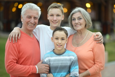 Portrait of a happy family portrait on tropical resortの写真素材