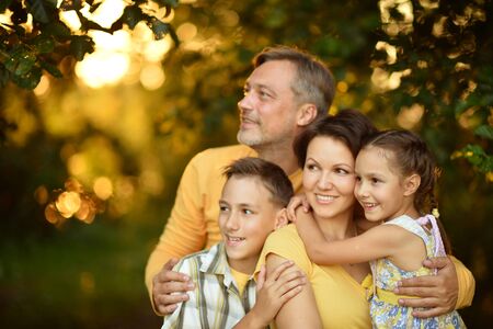 Happy Family resting in a summer parkの写真素材