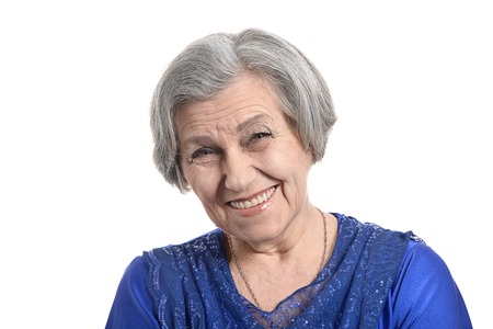 Portrait of a beautiful senior woman on a white backgroundの写真素材