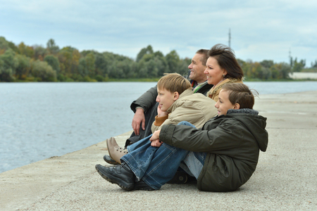 happy Family at river embankment in autumnの写真素材