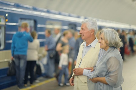 Portrait of beautiful elderly couple in subway