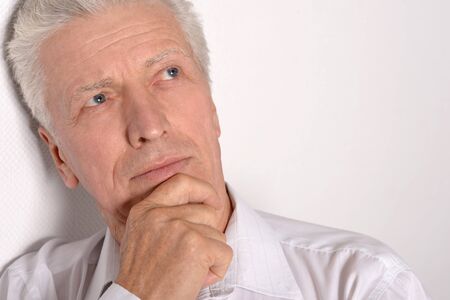 Portrait of Sad senior man at homeの写真素材