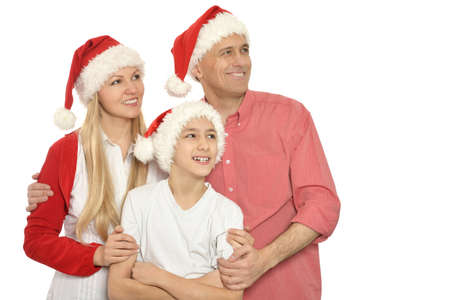 family with kids   in santa hats on backgroundの写真素材