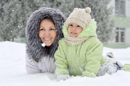 Portrait of a mother and daughter in winterの写真素材