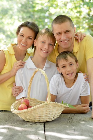 Portrait of a happy family having picnic in summerの写真素材