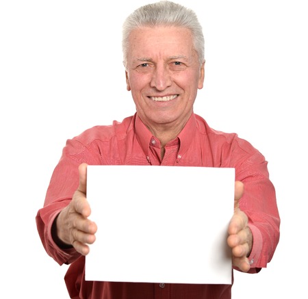 Senior man with blank advertising board or copy space, isolated on whiteの写真素材