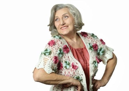 Portrait of elderly woman showing thumbs up on white backgroundの写真素材