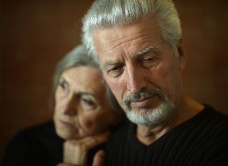 close-up portrait of senior couple on  backgroundの写真素材