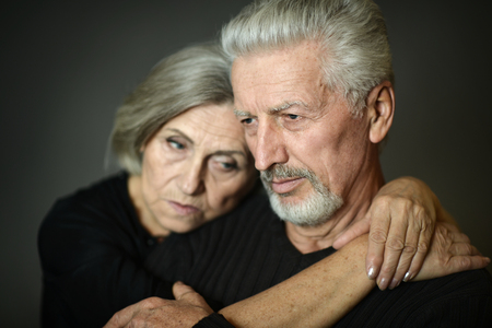 close-up portrait of senior couple on  backgroundの写真素材