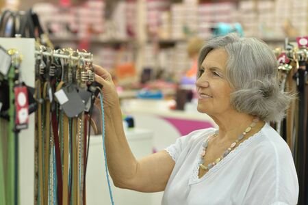 Portrait of a smiling old lady in store