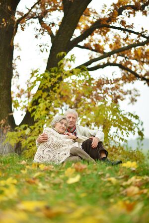 Mature married couple having fun on fresh air in autumnの写真素材