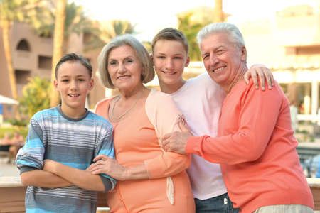 Happy family on tropical resort near hotel
