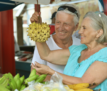 Portrait of beautiful elderly couple in  marketの写真素材