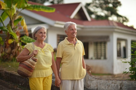 Portrait of a senior couple relaxing near  hotel resort