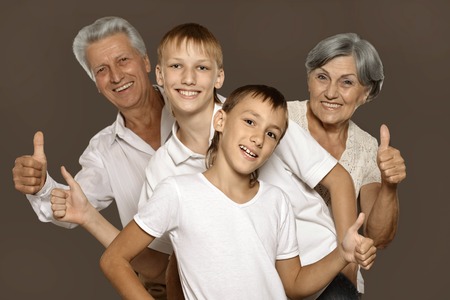 Portrait of a happy grandparents and their two grandchildren