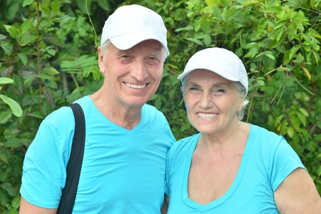 Happy elderly couple   in tropical garden outdoor
