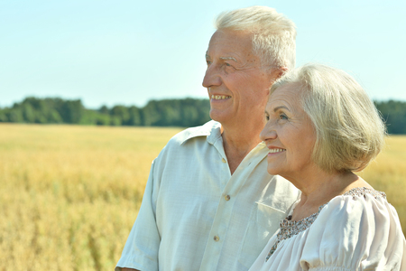 Loving mature couple in field  at summerの写真素材