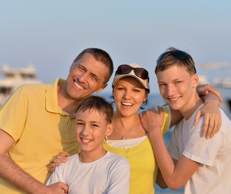 Portrait of a happy family at beach in summerの写真素材