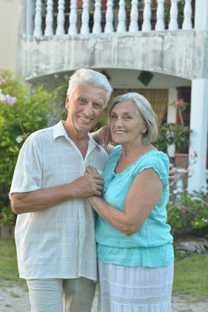 Portrait of a senior couple relaxing near  hotel resort