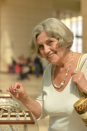 Beautiful senior woman in a shopping center
