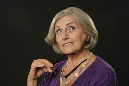 Lovely old woman on a white background