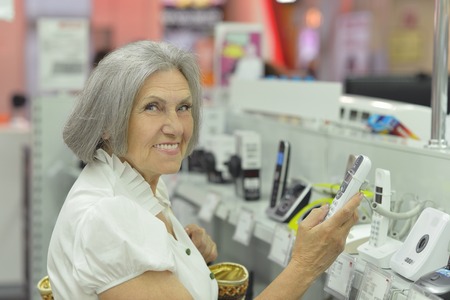 Beautiful senior woman in a shopping centerの写真素材