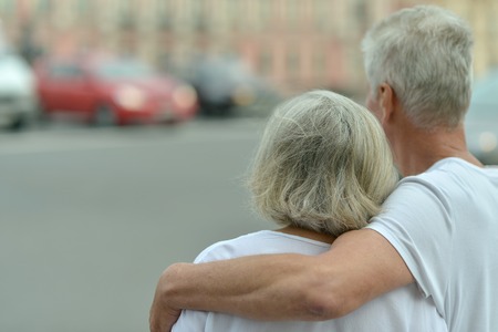 Portrait of a nice mature couple in townの写真素材