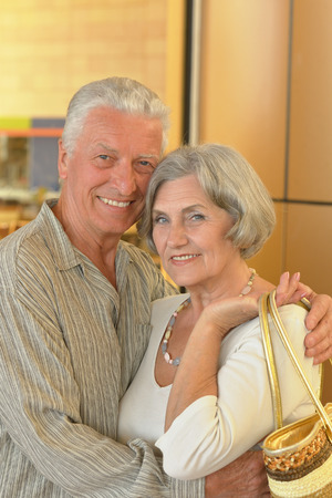 Beautiful senior couple in a shopping center