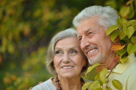 Loving mature couple  in a summer park