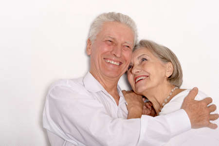 Happy older pair on a white background